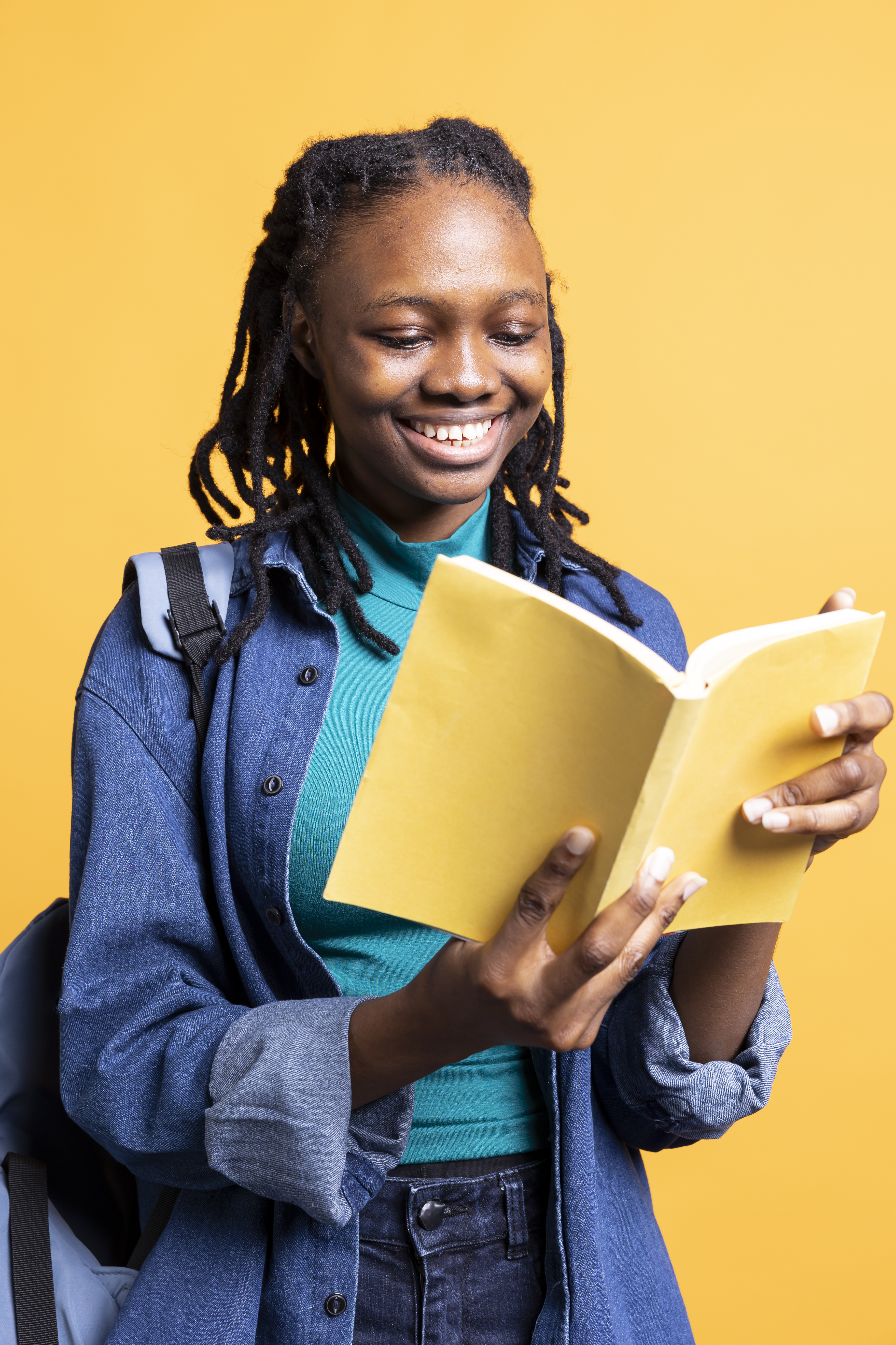 Black student reading a book